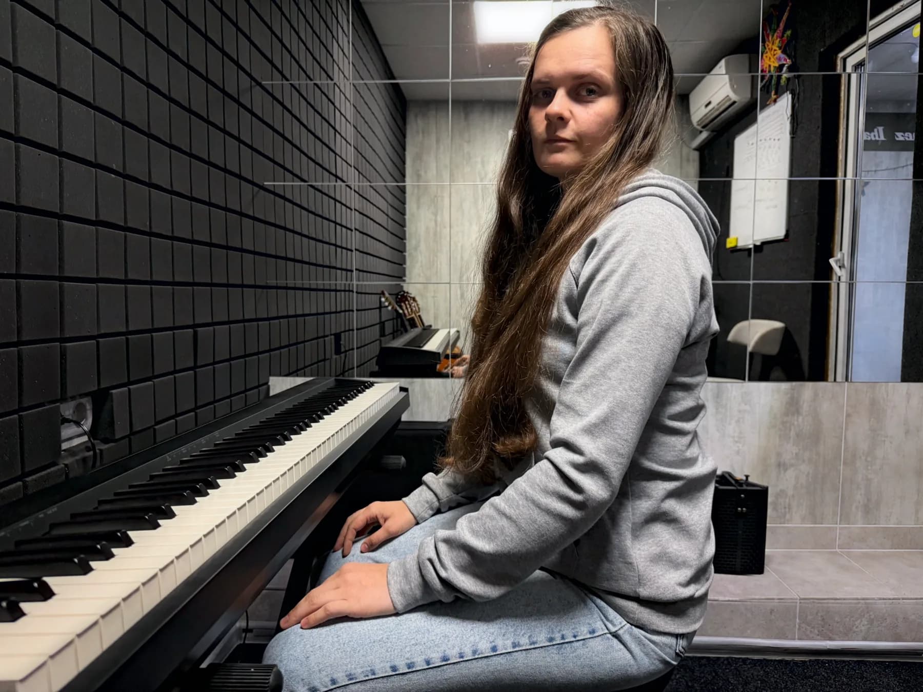 Olena Yaremchuk at a digital piano in a Velikhan Music Academy classroom